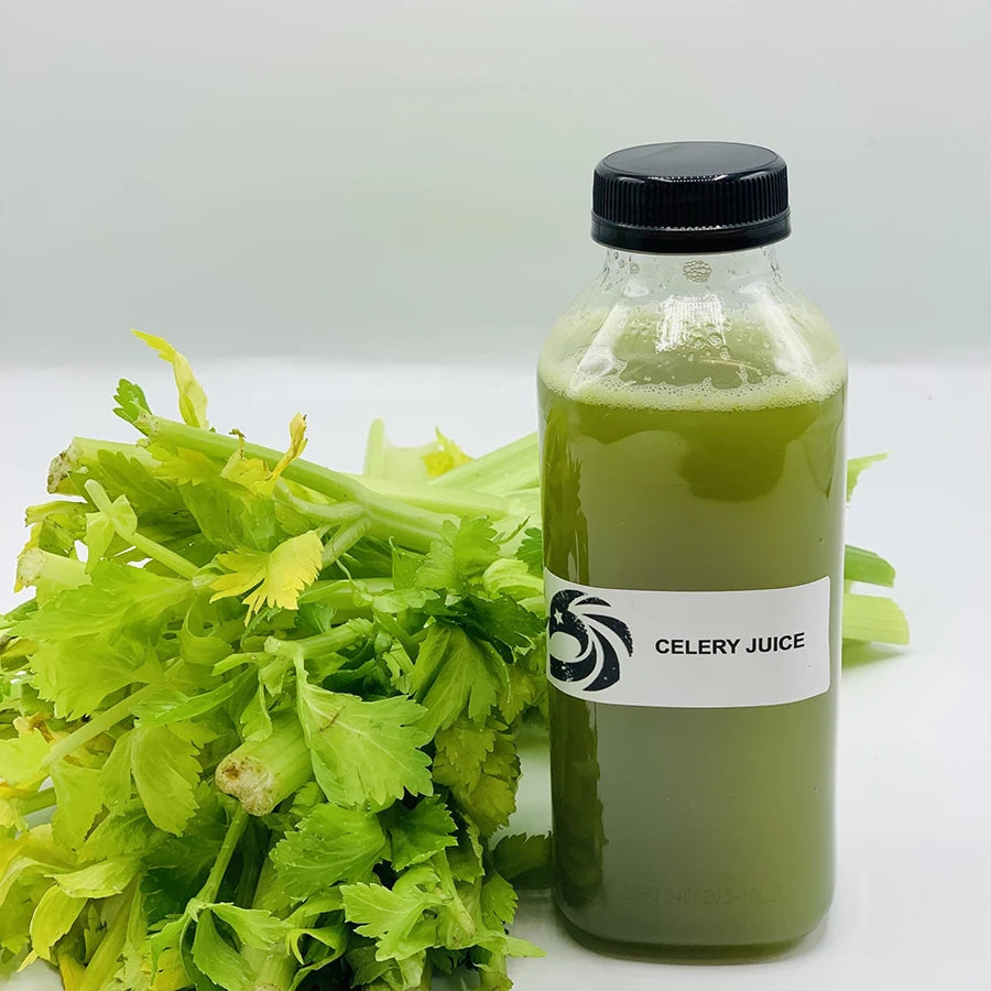 Bottle of celery juice with celery stalks