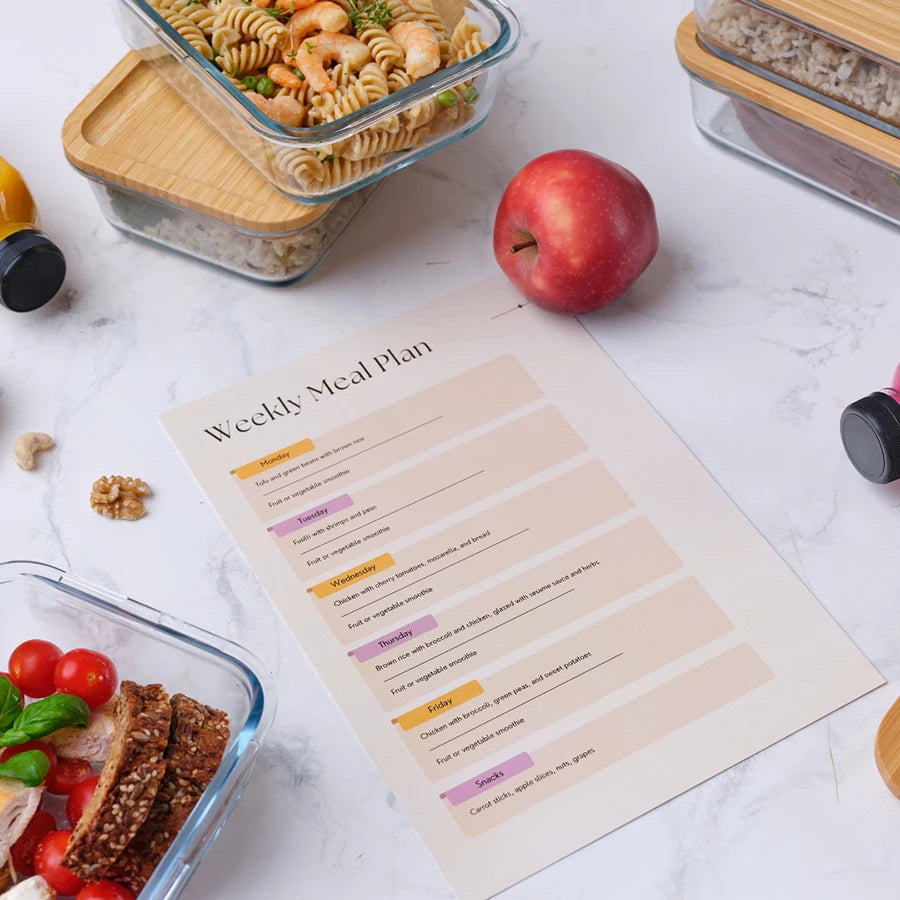 Weekly meal plan sheet with containers of food 