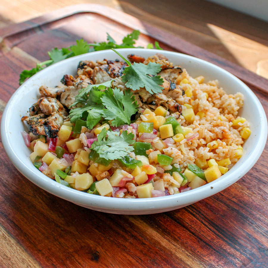Jerk Chicken Thighs with Paprika Rice and Mango Salsa