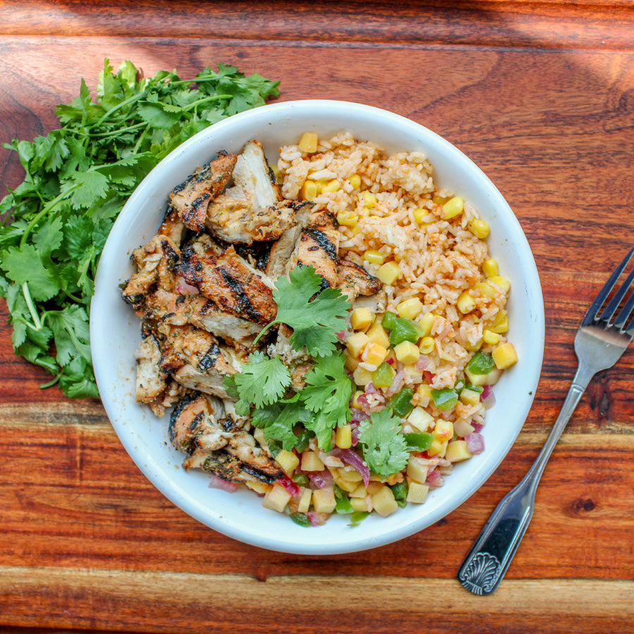 Jerk Chicken Thighs with Paprika Rice and Mango Salsa