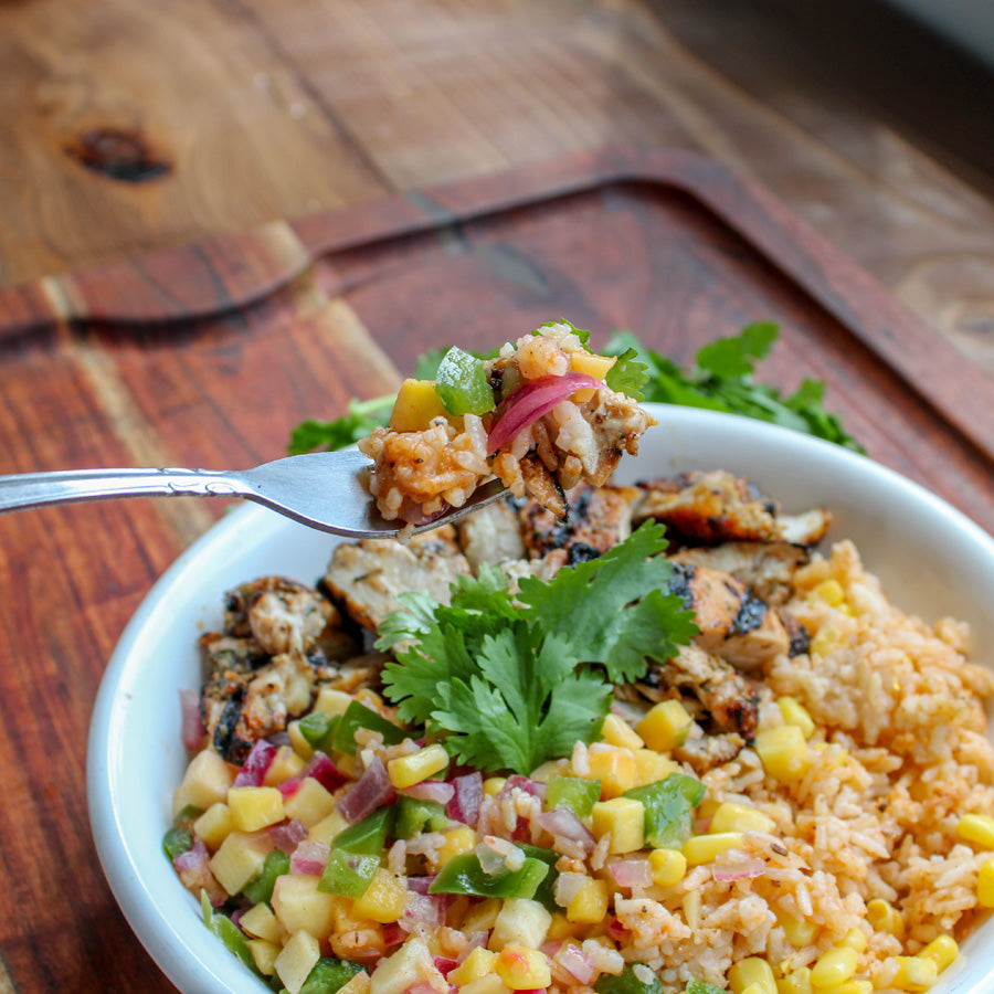 Jerk Chicken Thighs with Paprika Rice and Mango Salsa