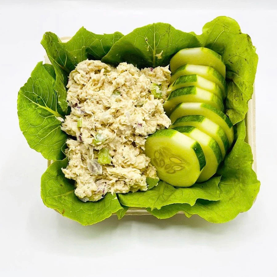 Tuna salad, sliced cucumbers, and lettuce leaves